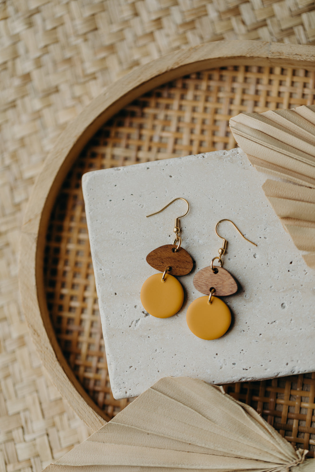 triangular polymer clay earrings in eucalyptus green with rectangular wooden pendant