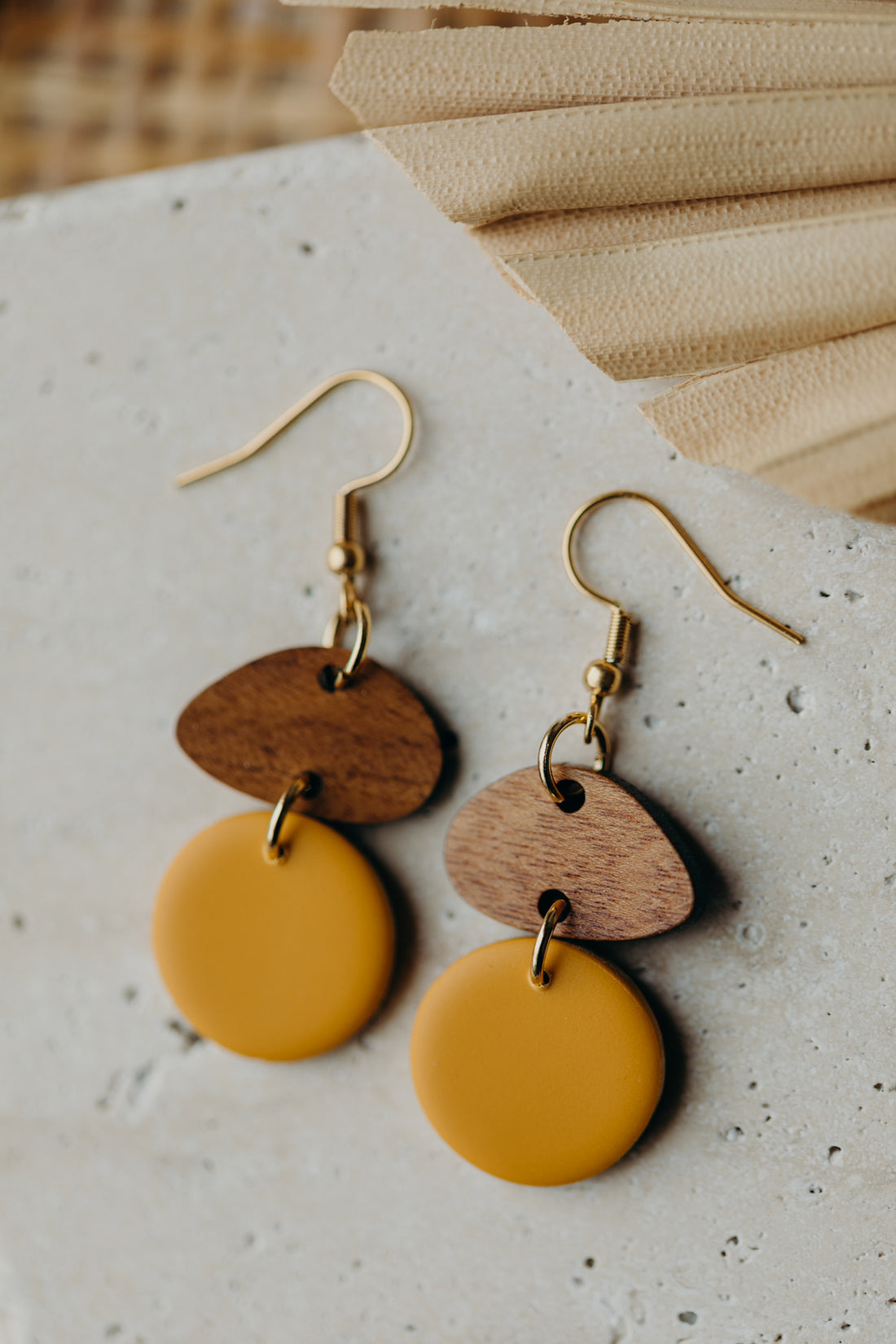 triangular polymer clay earrings in eucalyptus green with rectangular wooden pendant