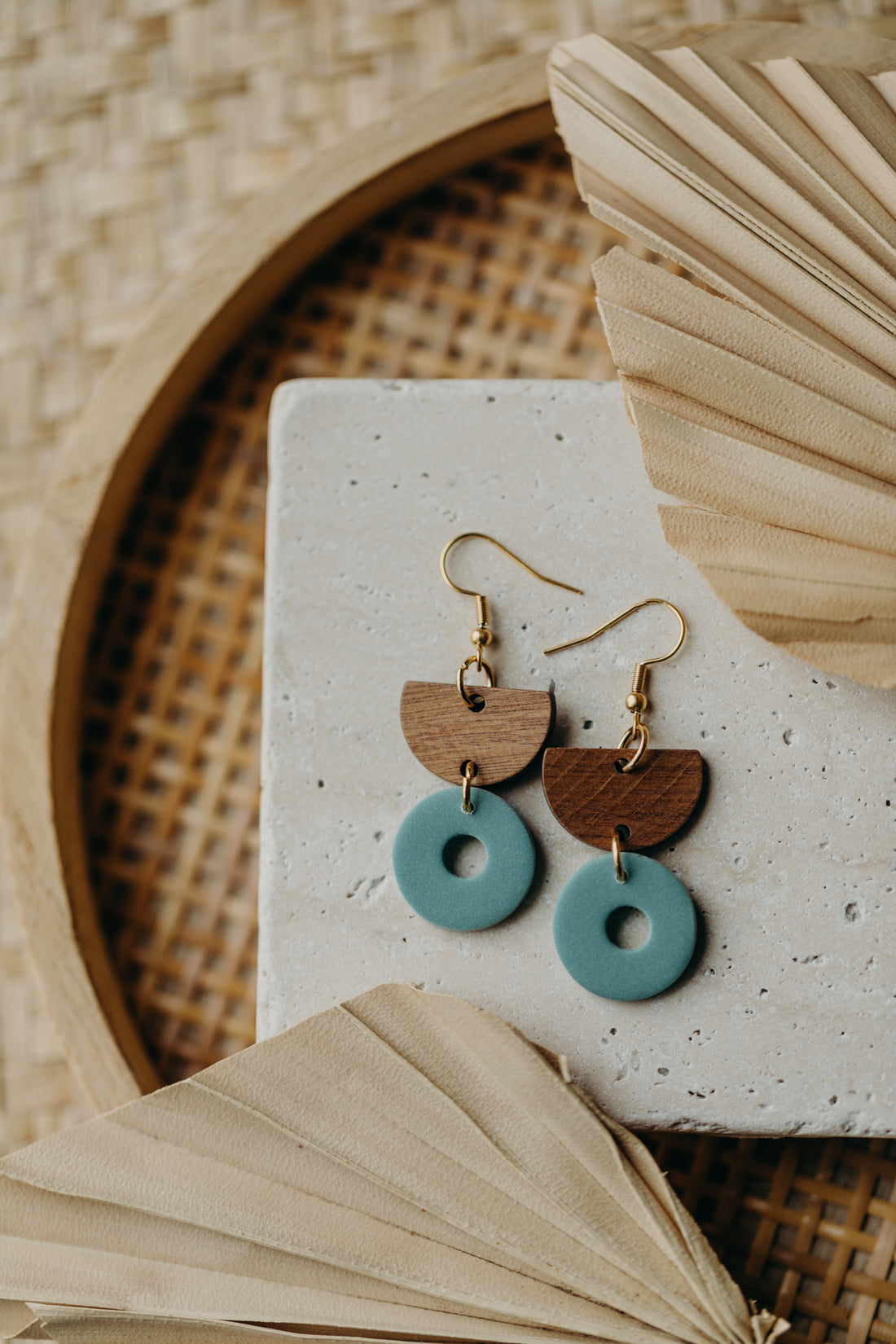 triangular polymer clay earrings in eucalyptus green with rectangular wooden pendant