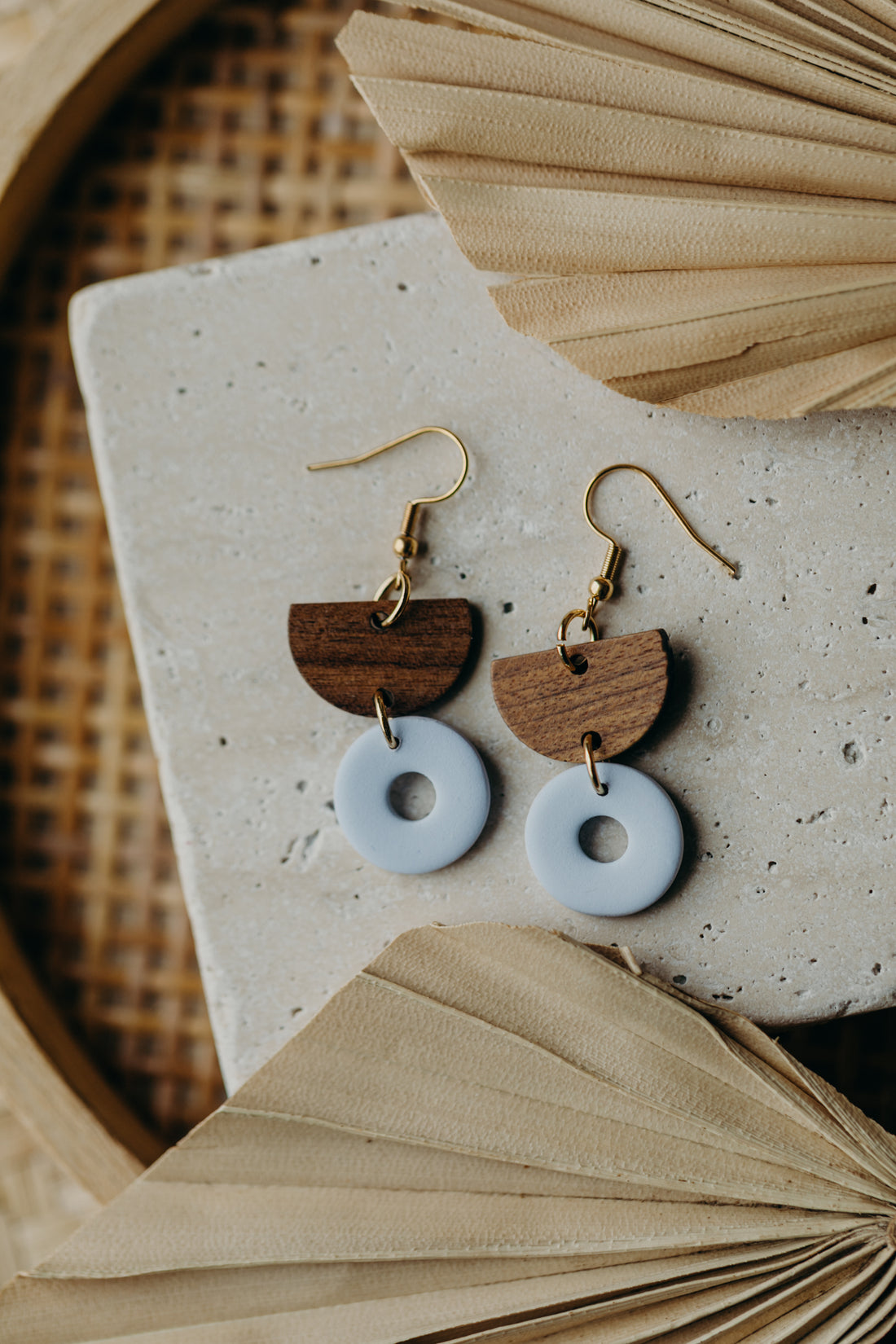 triangular polymer clay earrings in eucalyptus green with rectangular wooden pendant