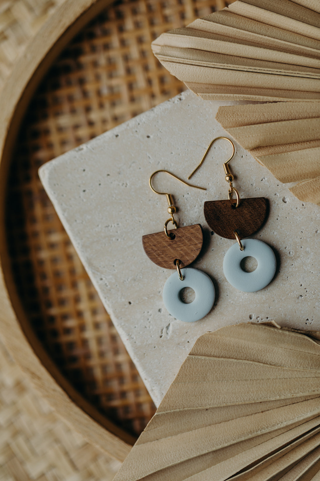 triangular polymer clay earrings in eucalyptus green with rectangular wooden pendant