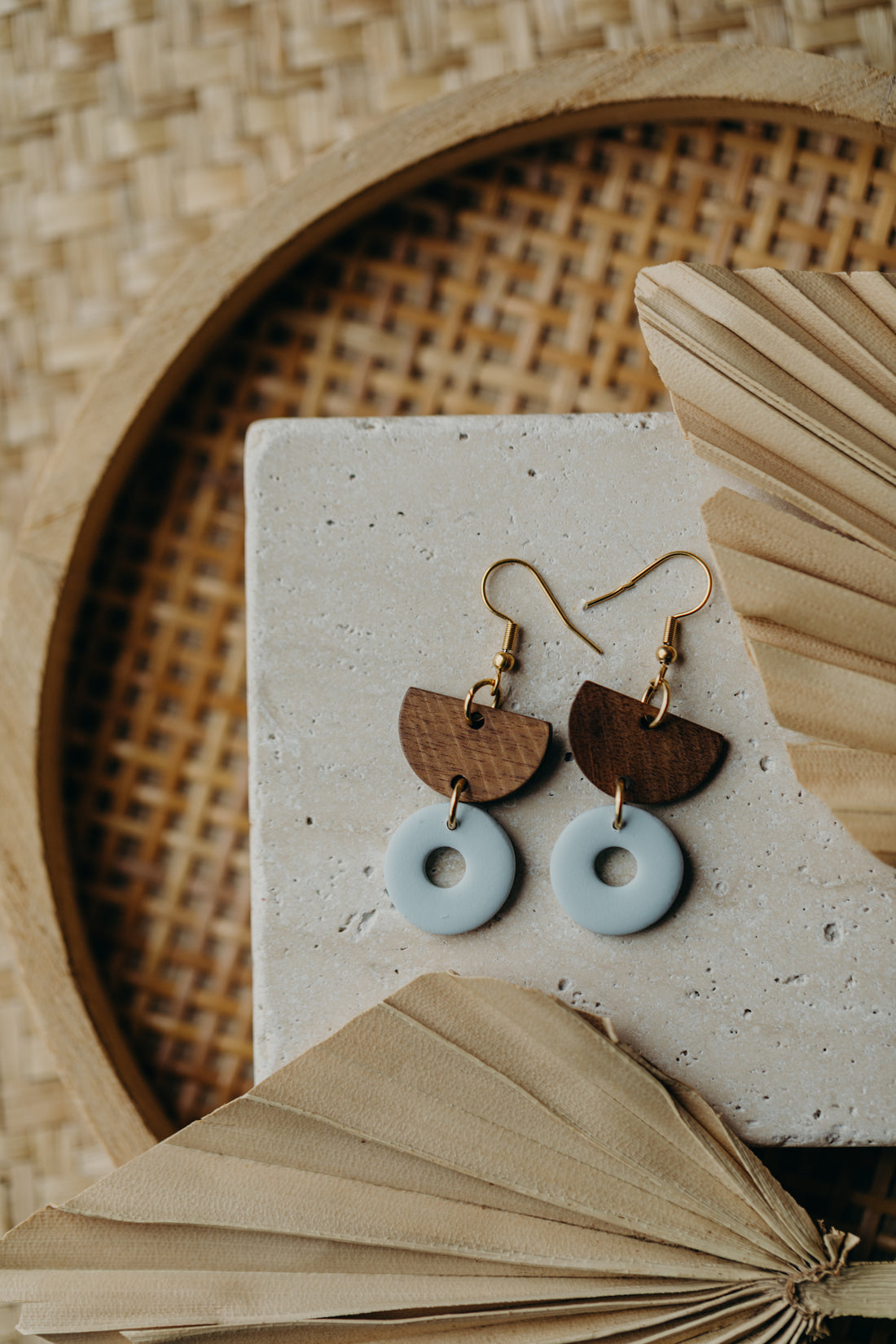 triangular polymer clay earrings in eucalyptus green with rectangular wooden pendant