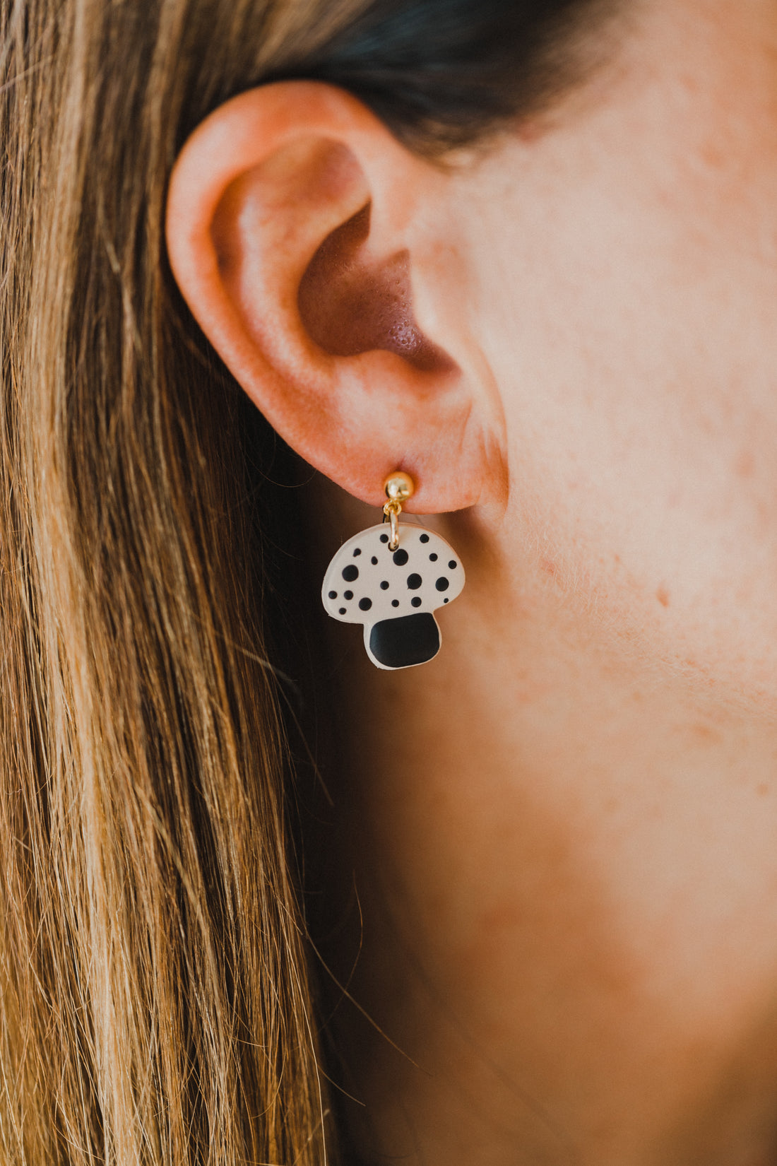 golden earrings with acrylic in white, petrol and brown