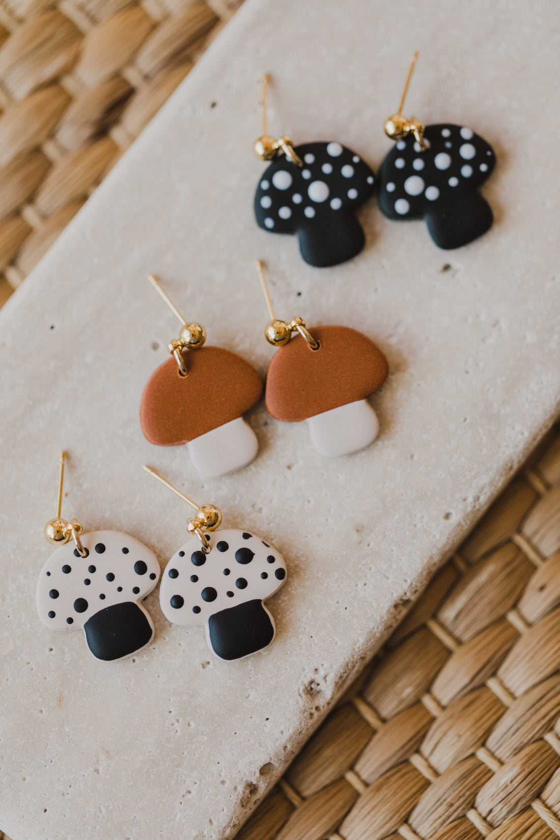 golden earrings with acrylic in white, petrol and brown