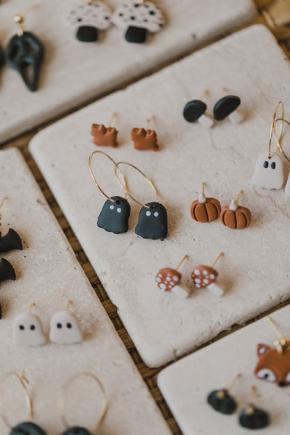 golden earrings with acrylic in white, petrol and brown