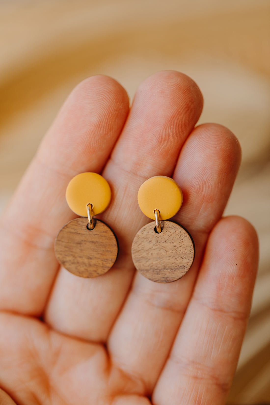 mustard yellow round polymer clay earrings with round wooden pendant