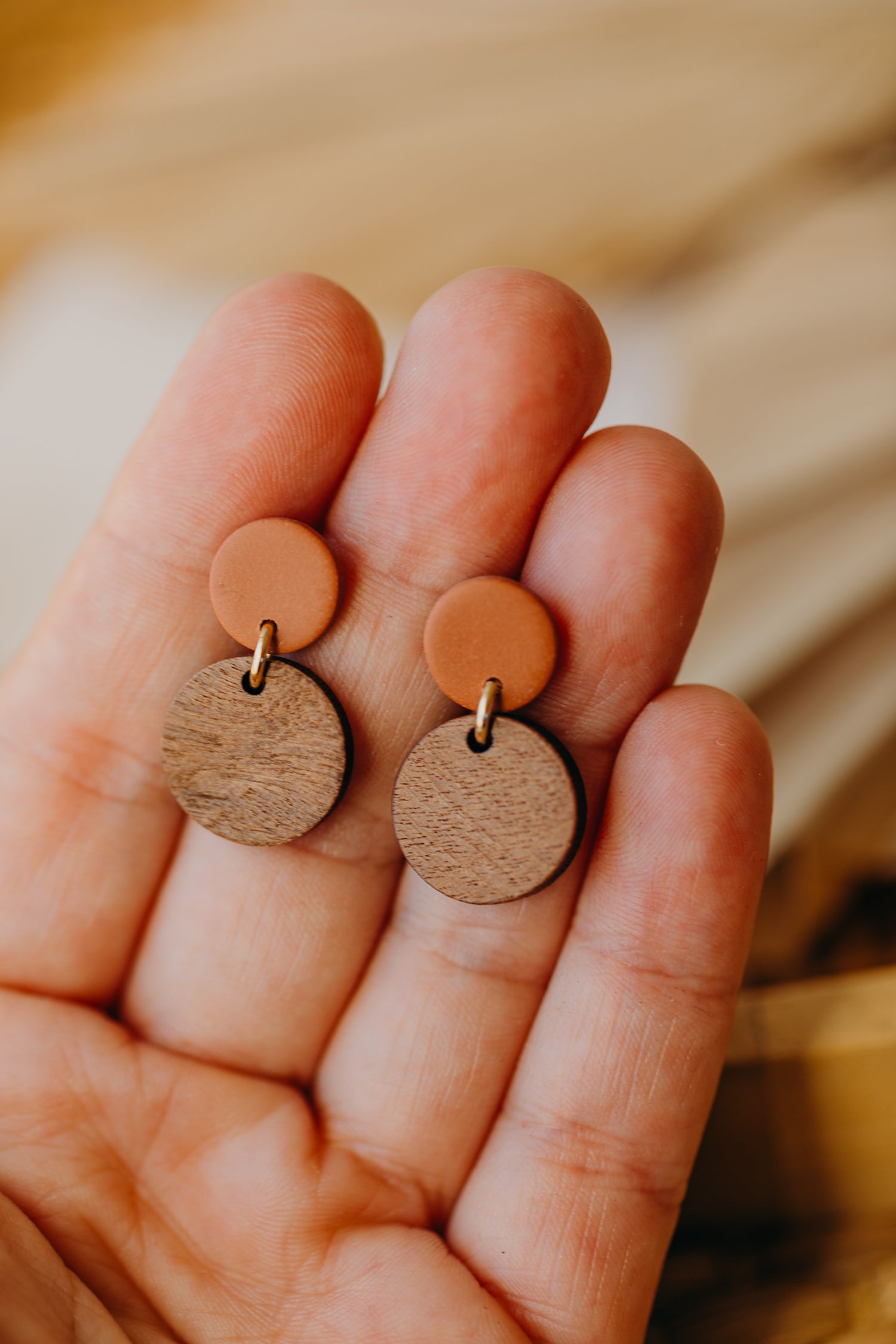 Cinnamon colored round polymer clay earrings with round wooden pendant