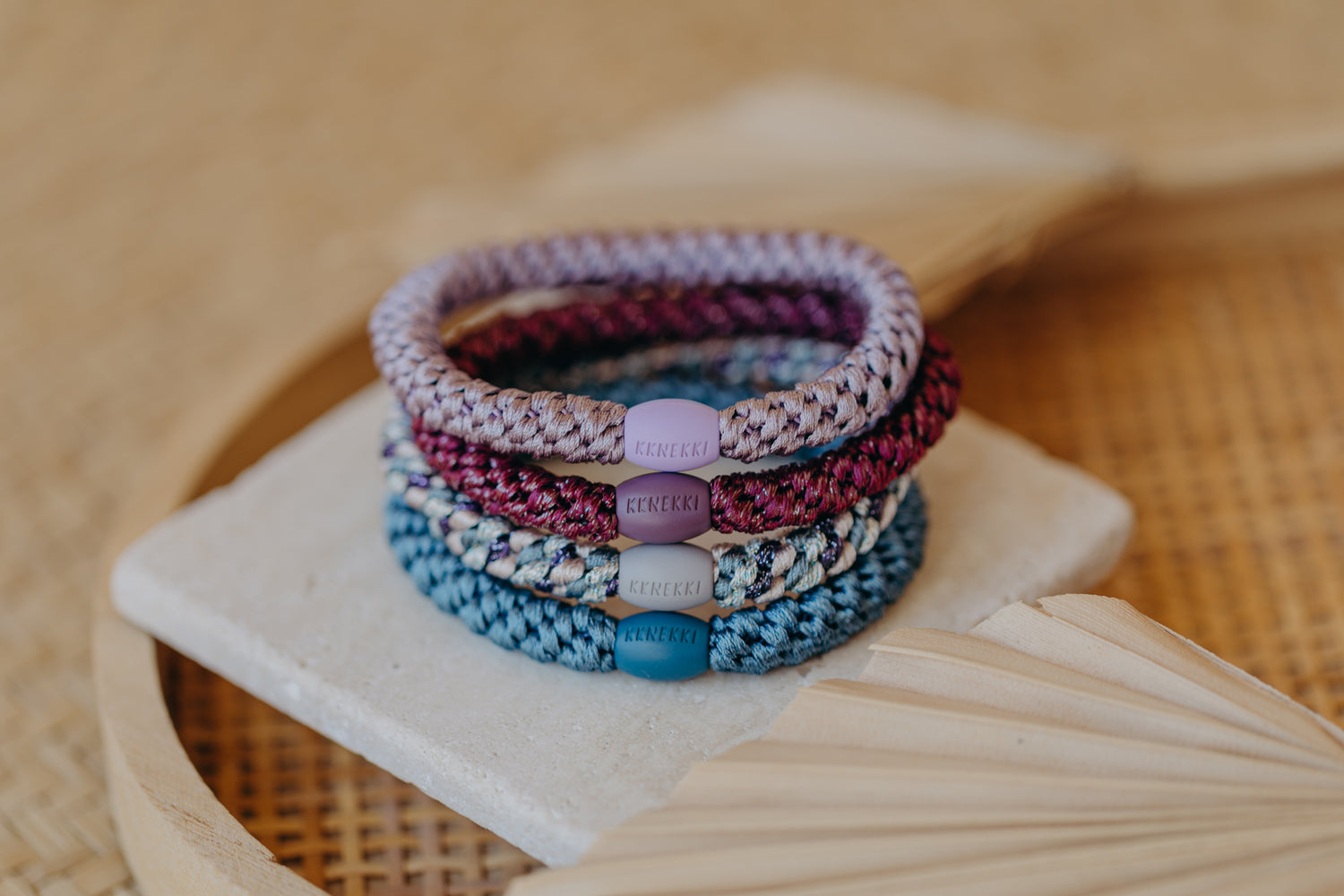 KKNEKKI hair tie set of 4 in shades of grey, green and black