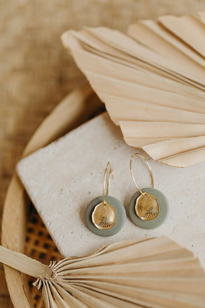 Hoop earrings with round polymer clay pendant and leaf