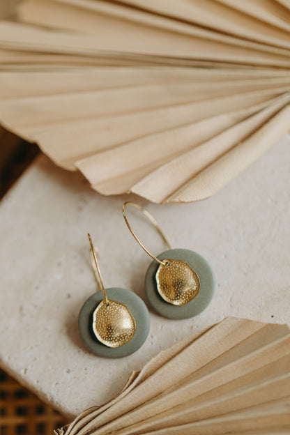 Hoop earrings with round polymer clay pendant and leaf