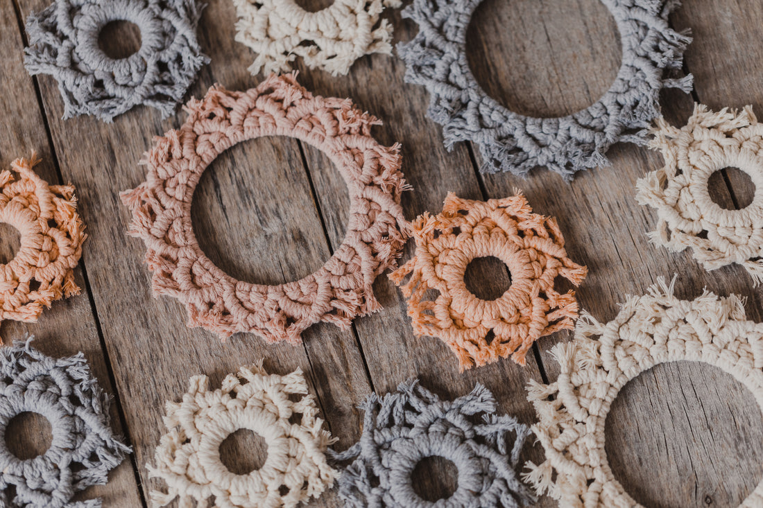 large macrame stars in the colors vanilla, pink and gray