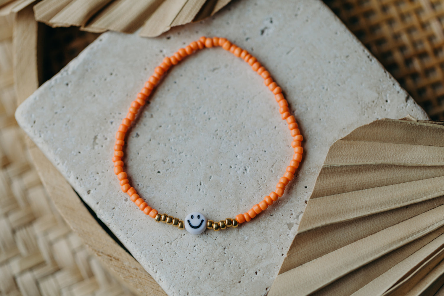 Smiley Perlenarmband in Orange