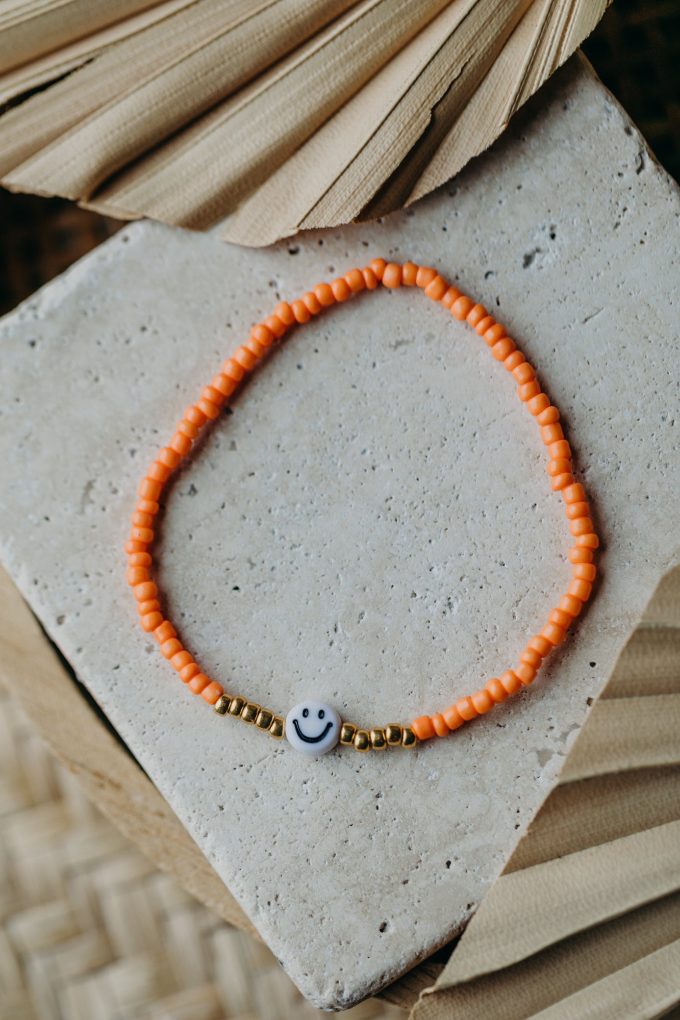 Smiley Perlenarmband in Orange