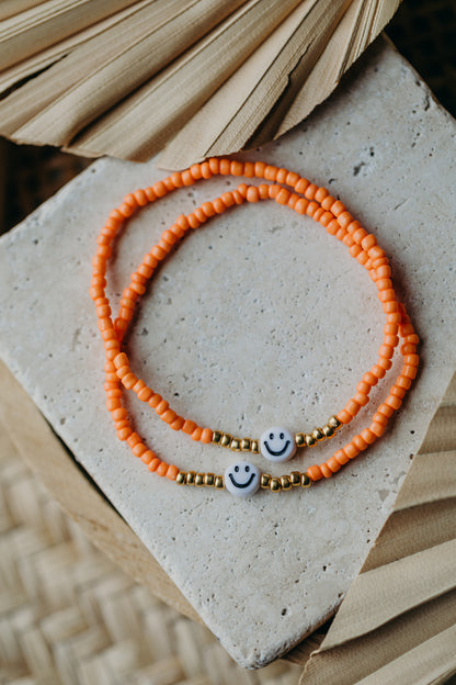Smiley Perlenarmband in Orange
