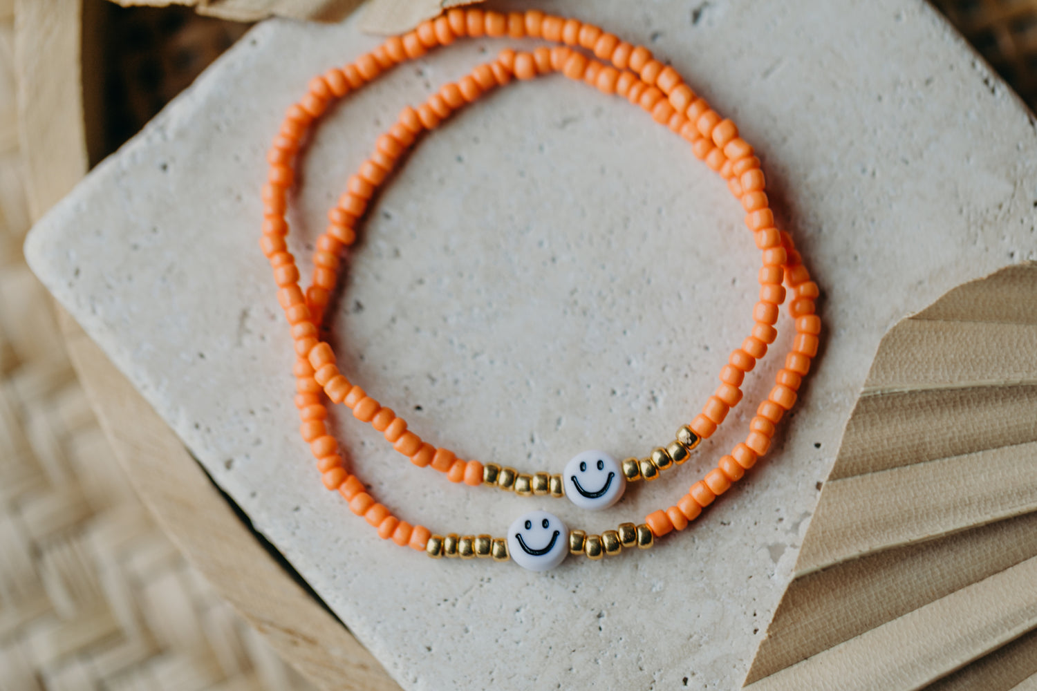 Smiley Perlenarmband in Orange