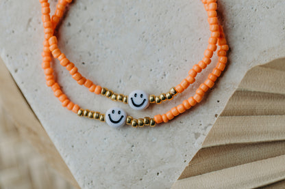 Smiley Perlenarmband in Orange