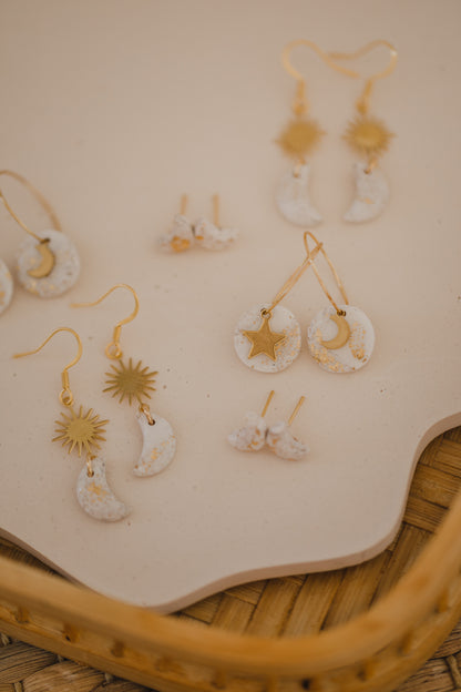 Hoop earrings with round polymer clay pendant and leaf