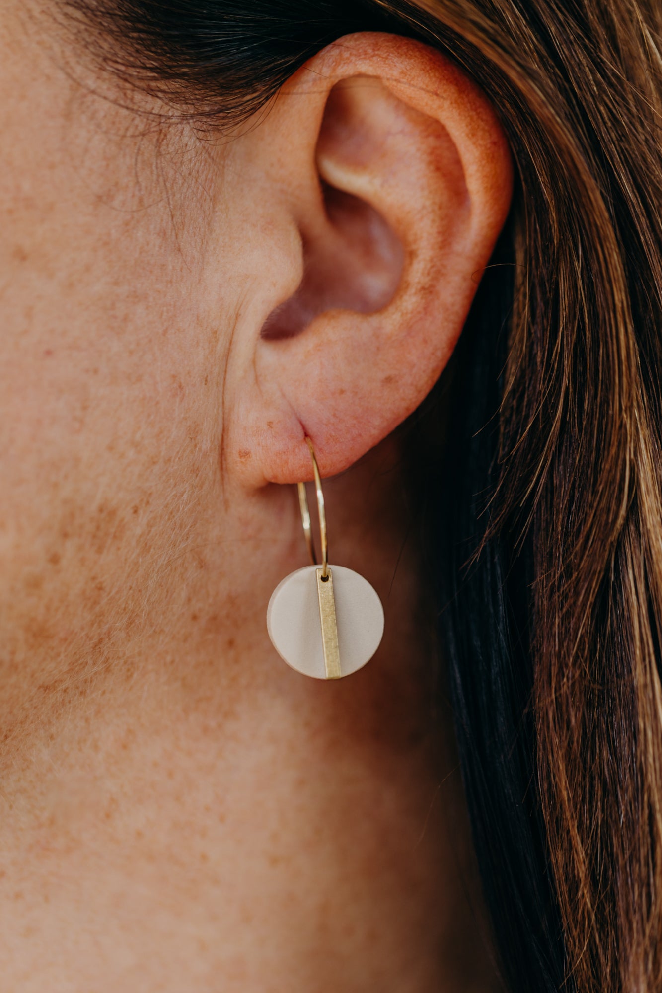 Hoop earrings with round polymer clay pendant and leaf