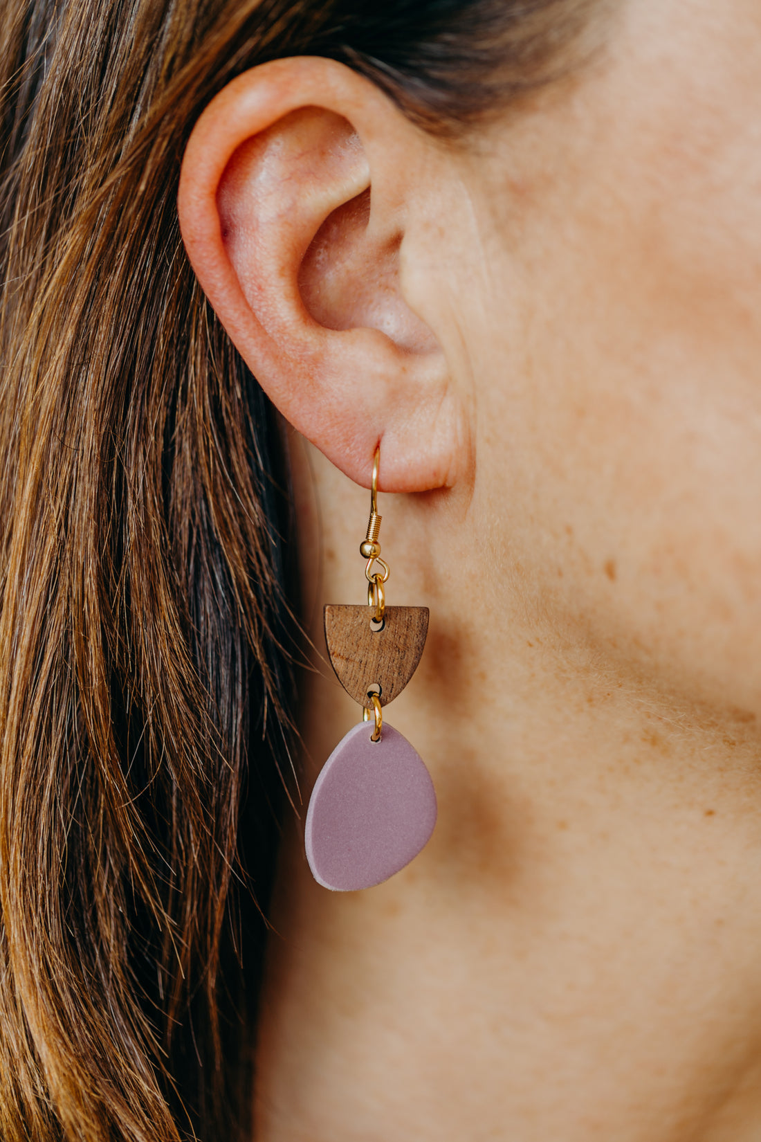 triangular polymer clay earrings in eucalyptus green with rectangular wooden pendant