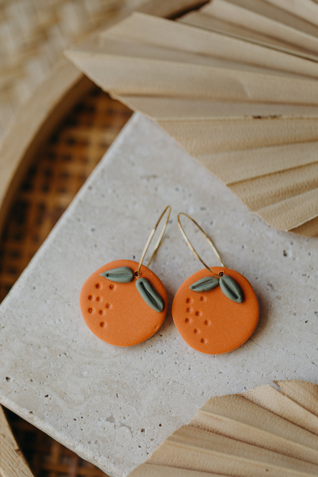 Hoop earrings with round polymer clay pendant and leaf