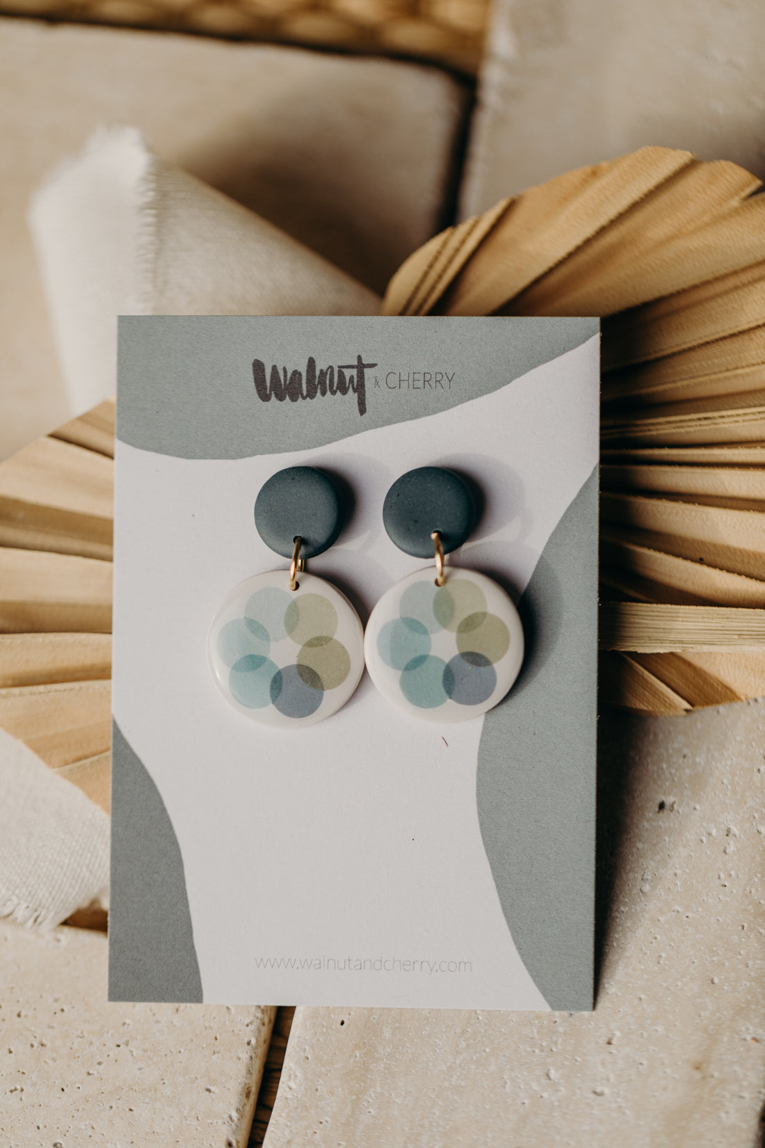 MARLA - round dark blue polymer clay earrings with blue and green dots