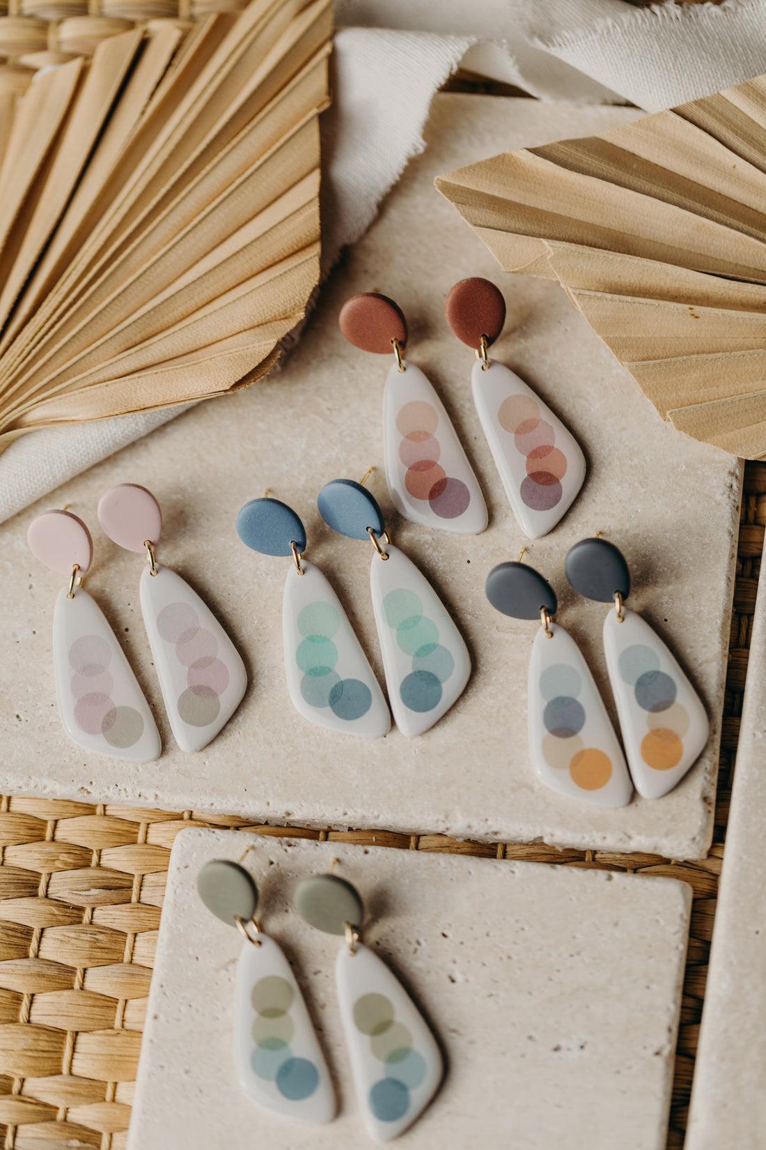 elongated polymer clay earrings with pink dots