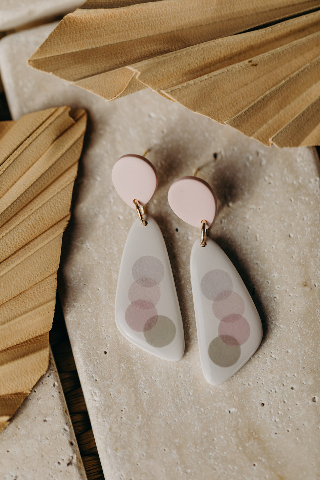 elongated pink polymer clay earrings with pink and grey dots
