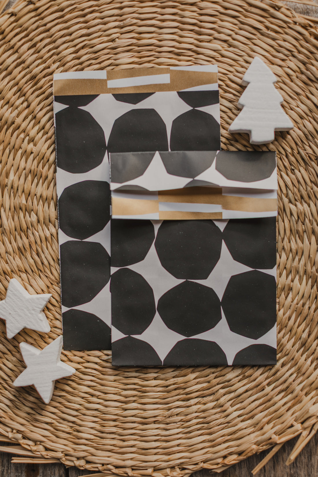 large paper bag with a small bird and branches