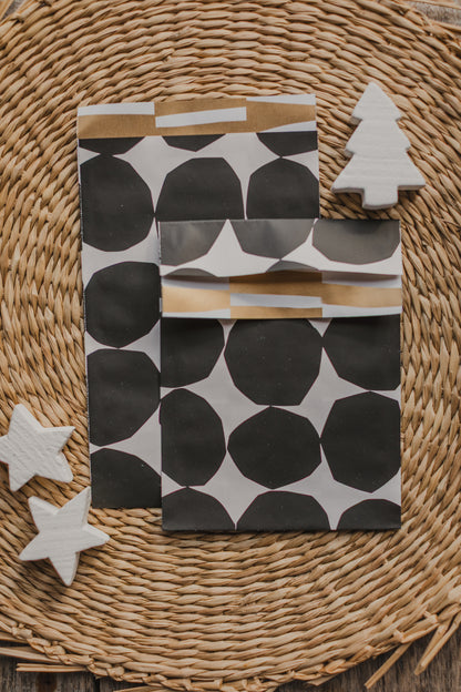 large paper bag with a small bird and branches