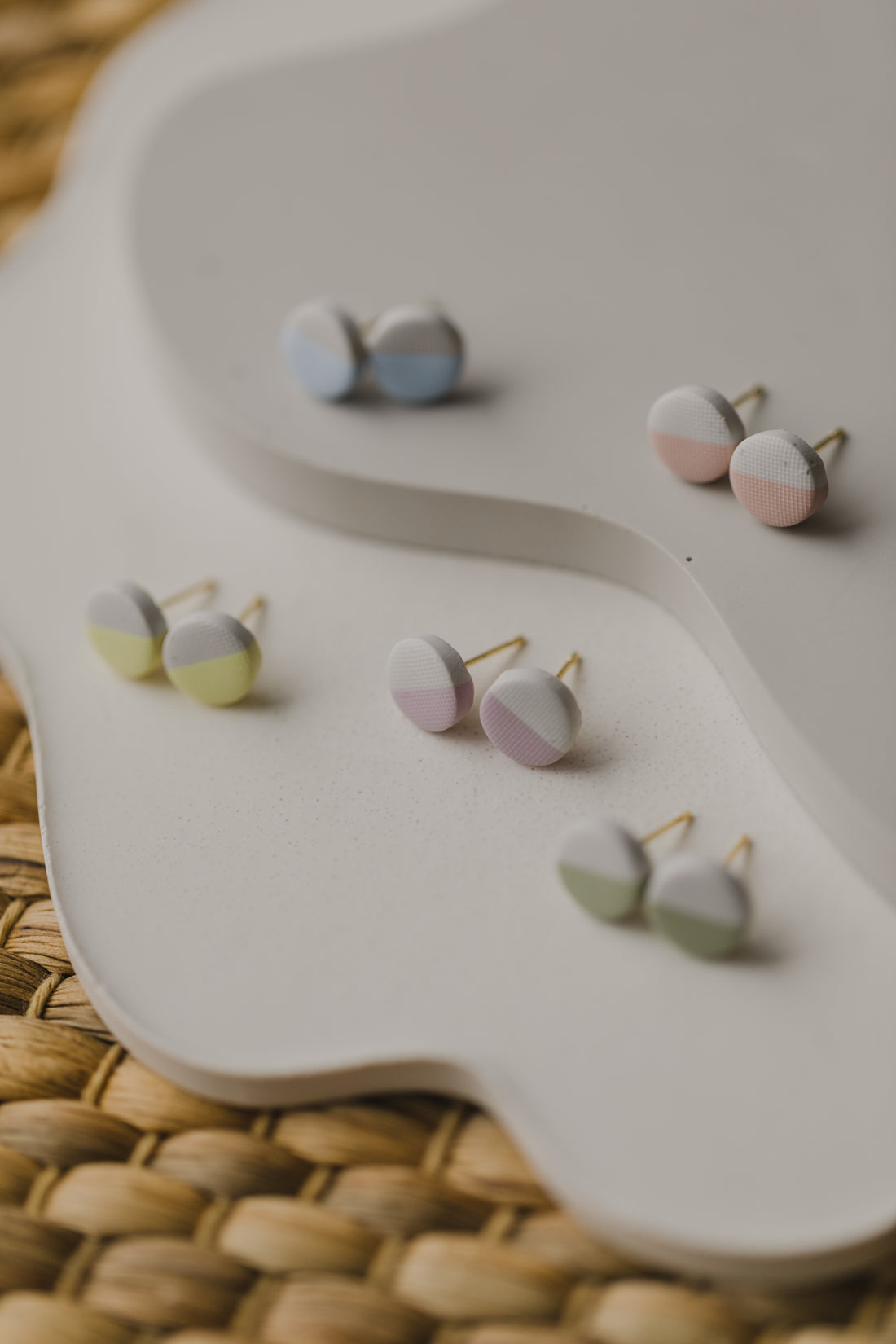 round two-tone polymer clay earrings in pastel colors