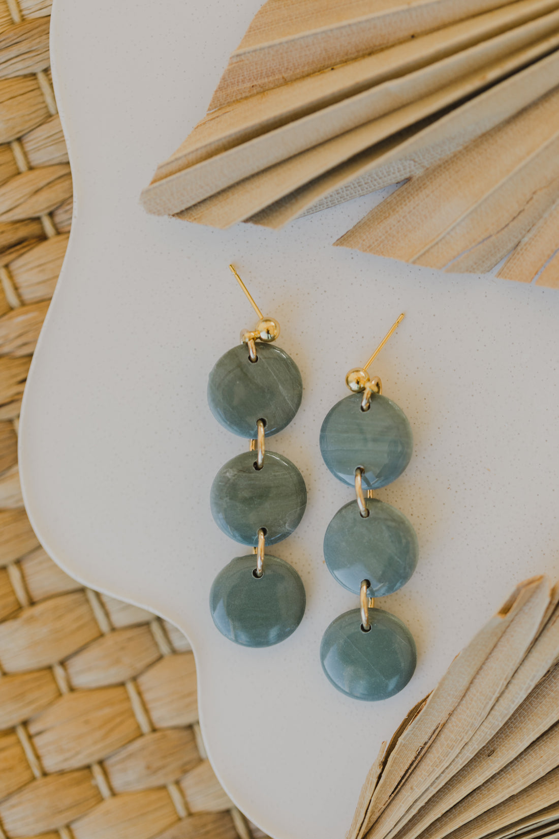 Hoop earrings with round polymer clay pendant and leaf