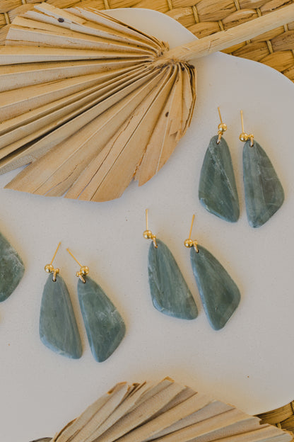 Hoop earrings with round polymer clay pendant and leaf