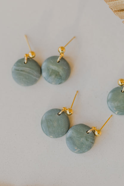 Hoop earrings with round polymer clay pendant and leaf