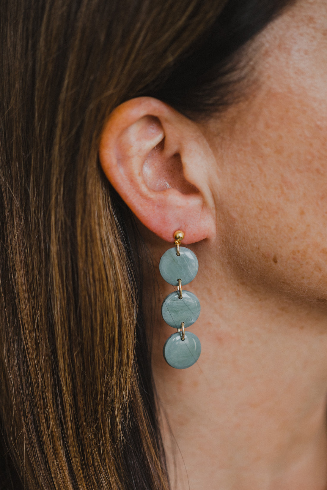 Hoop earrings with round polymer clay pendant and leaf