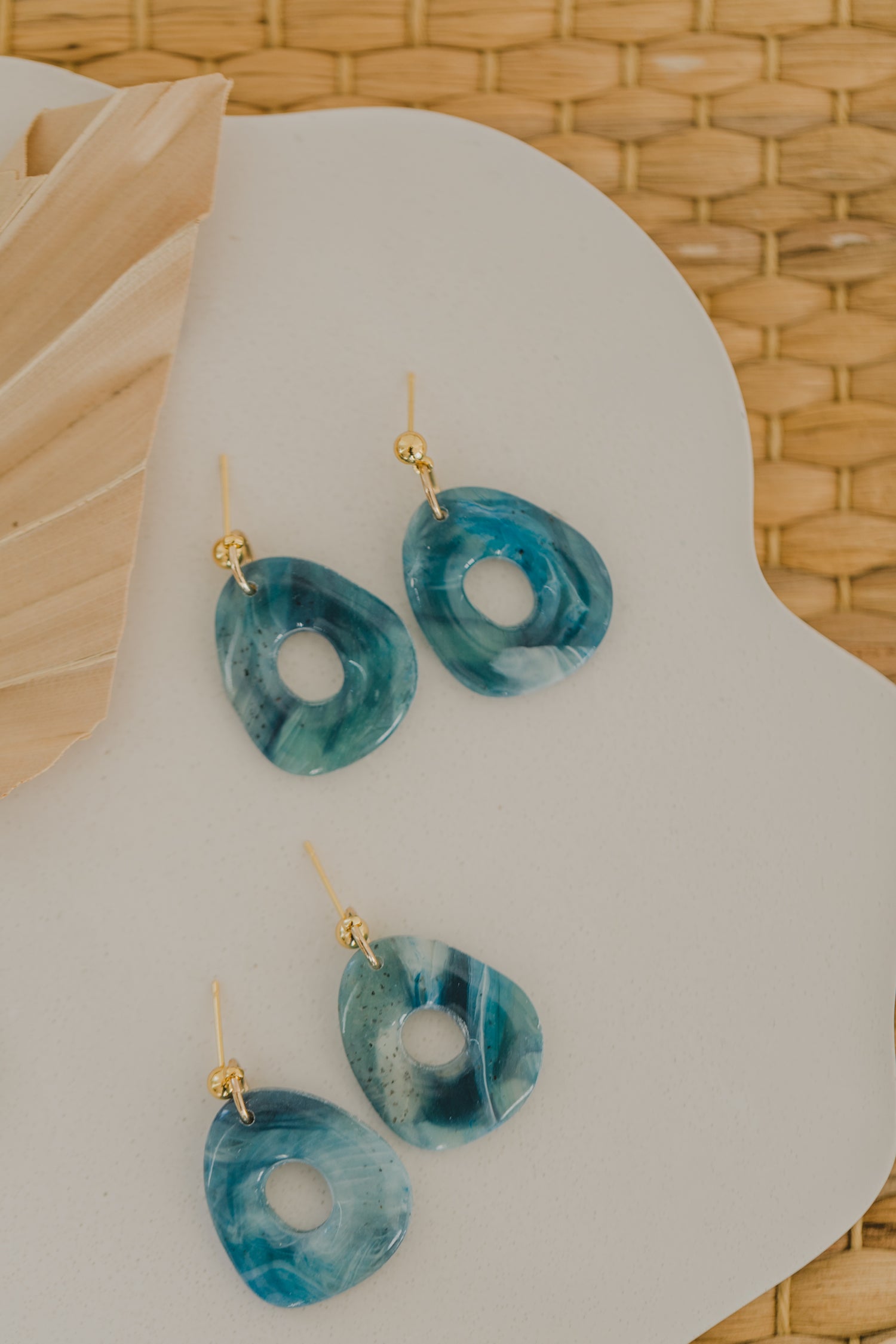 Hoop earrings with round polymer clay pendant and leaf