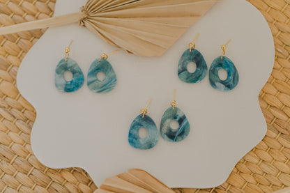Hoop earrings with round polymer clay pendant and leaf