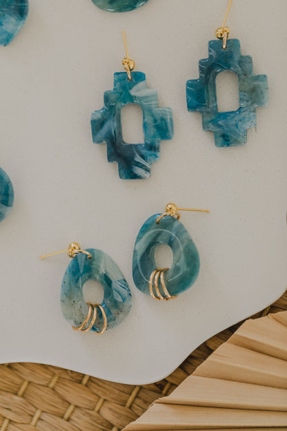 Hoop earrings with round polymer clay pendant and leaf