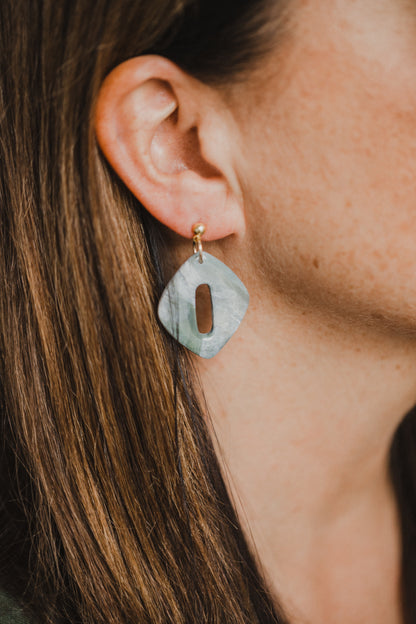 Hoop earrings with round polymer clay pendant and leaf