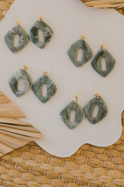 Hoop earrings with round polymer clay pendant and leaf