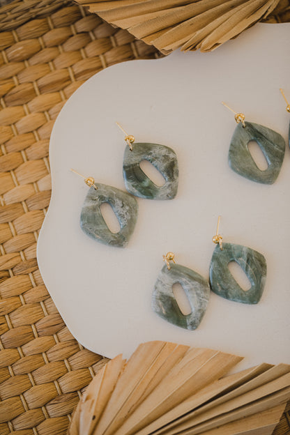 Hoop earrings with round polymer clay pendant and leaf