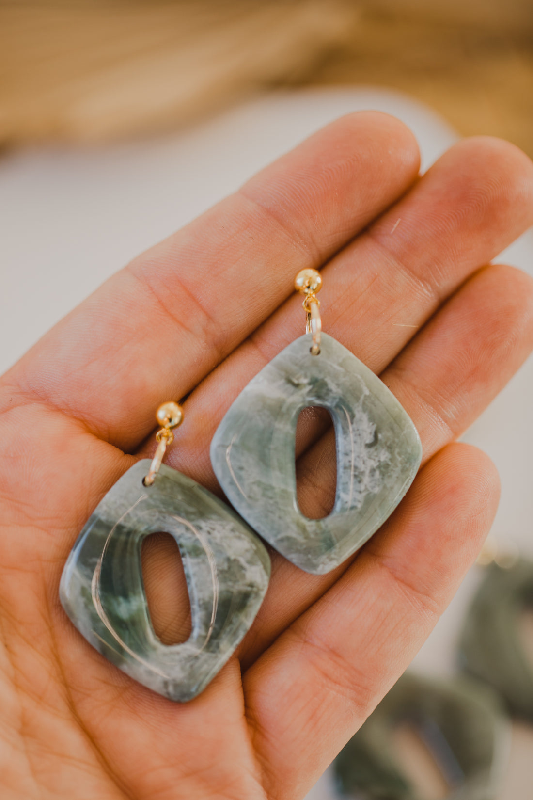 Hoop earrings with round polymer clay pendant and leaf