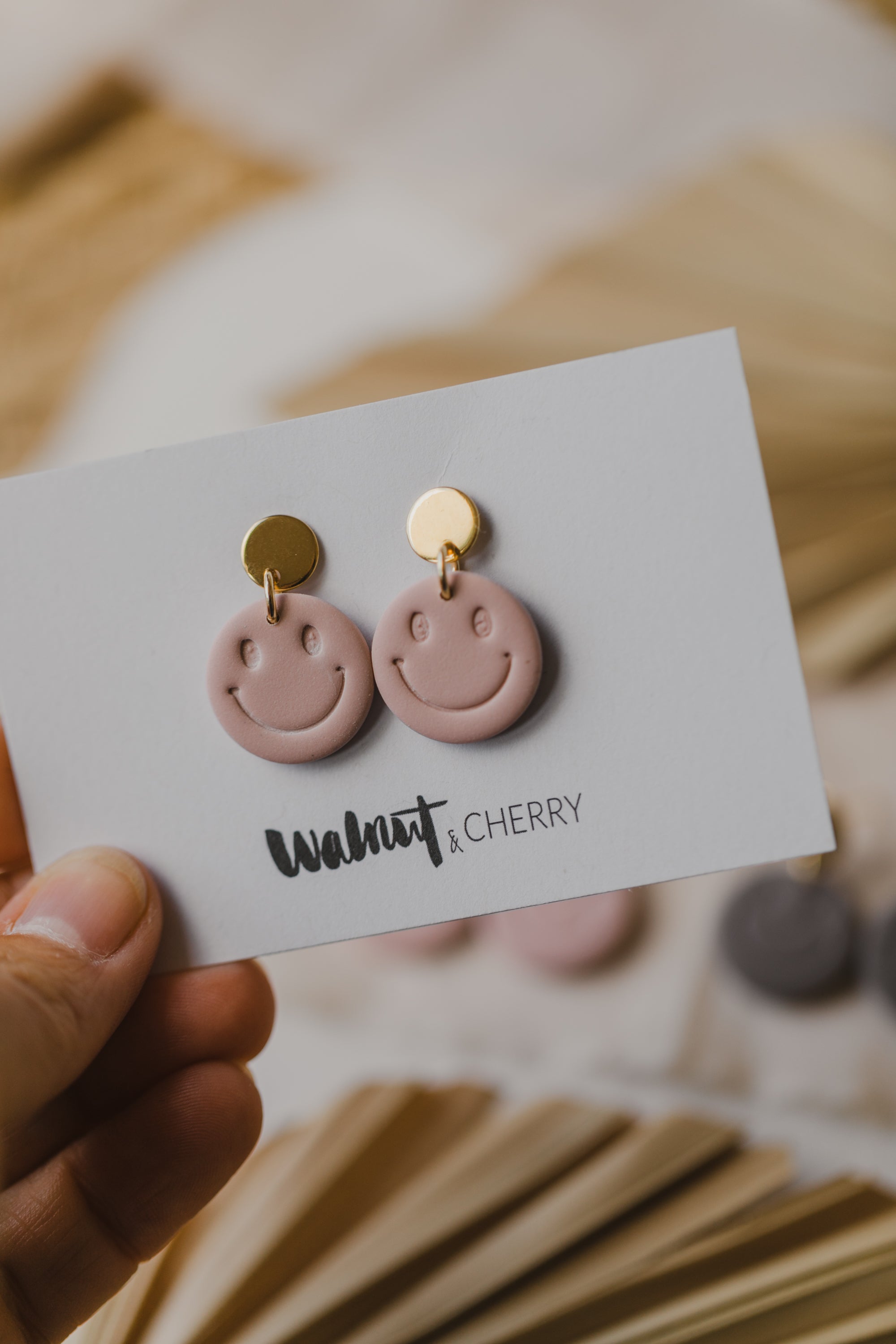 Smiley earrings made of polymer clay in soft colors