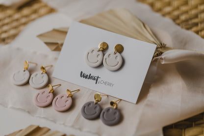 Smiley earrings made of polymer clay in soft colors