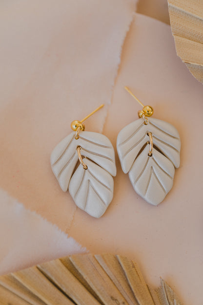 golden earrings with acrylic in white, petrol and brown