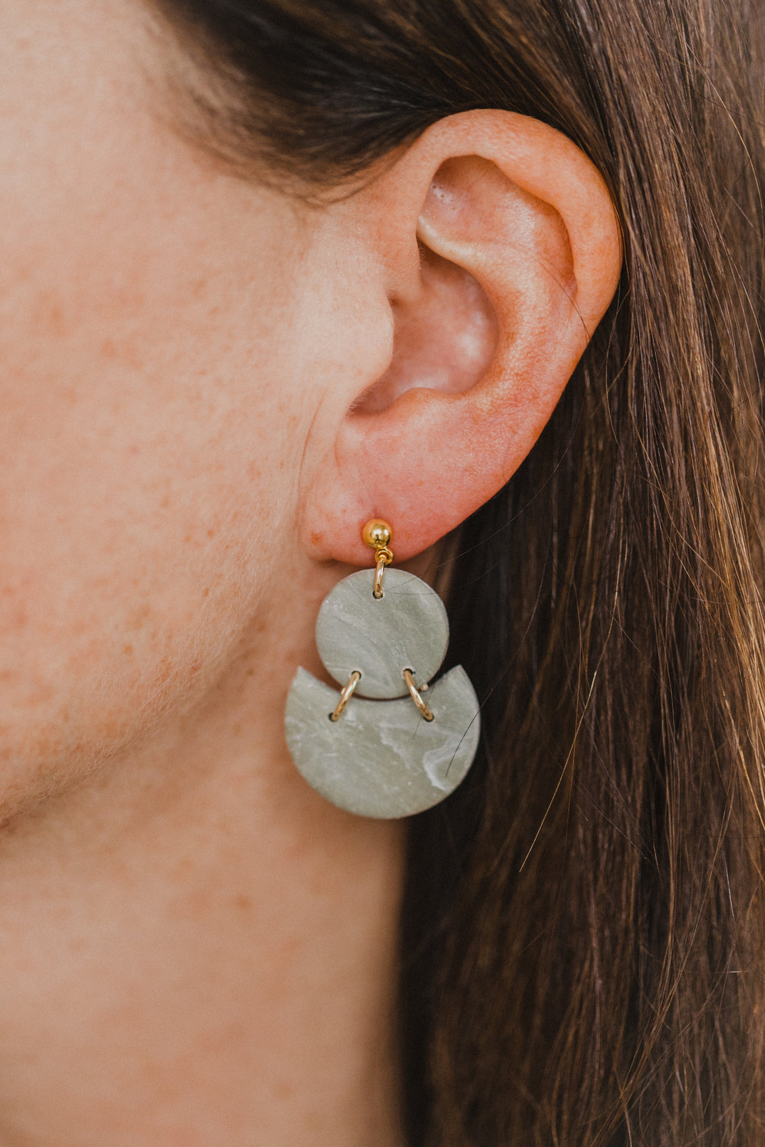 Hoop earrings with round polymer clay pendant and leaf