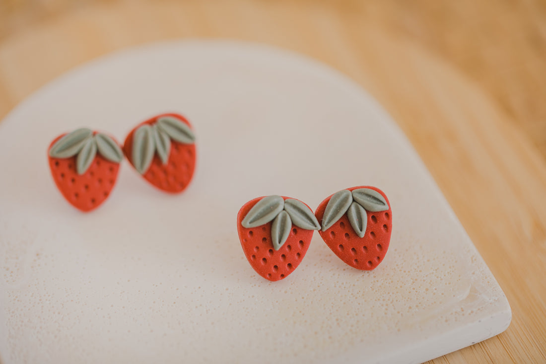 Hoop earrings with round polymer clay pendant and leaf