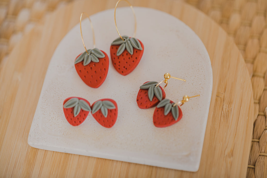 Hoop earrings with round polymer clay pendant and leaf