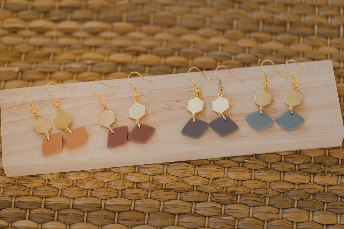 golden earrings with acrylic in white, petrol and brown