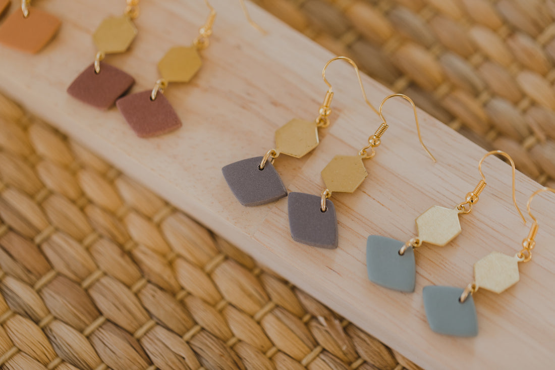 golden earrings with acrylic in white, petrol and brown