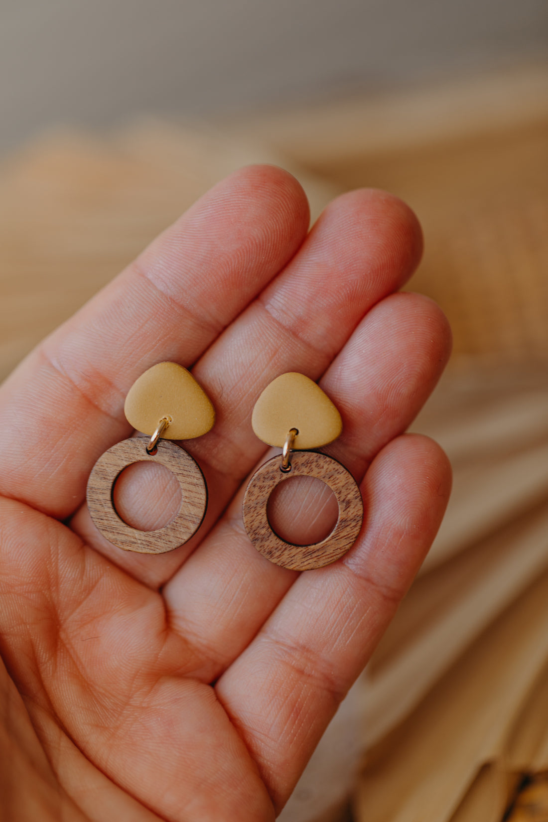 triangular polymer clay earrings in soft mustard yellow with small circle